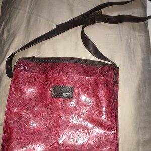 Red and brown embroidered bag with matching wallet